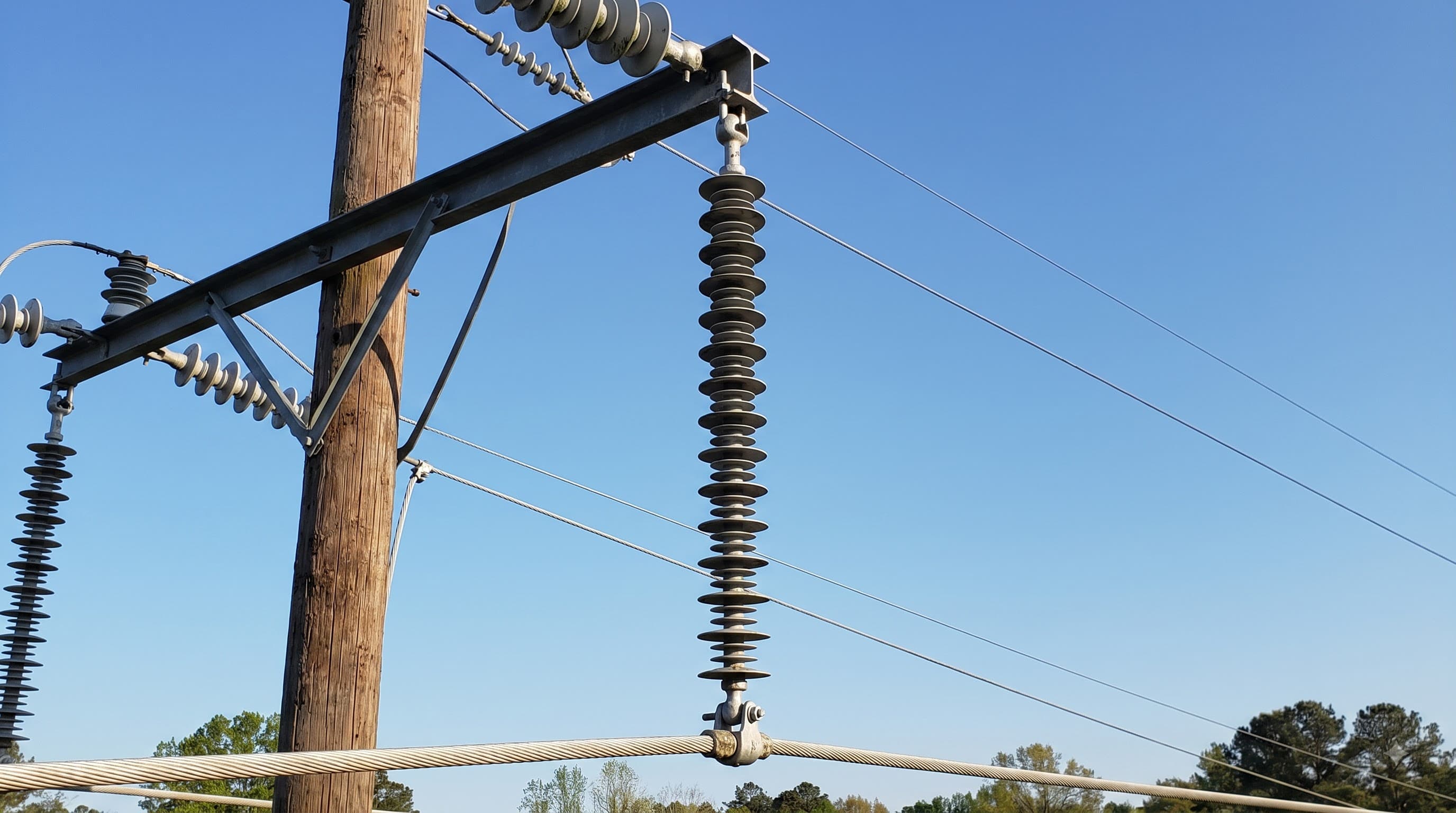 Polymer suspension insulator supporting an overhead power-line conductor